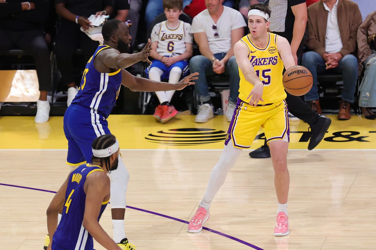 Los Angeles Lakers guard Austin Reaves (15) passes the basketball during an NBA game against the Golden State Warriors on February 7, 2025 in Los Angeles, CA.