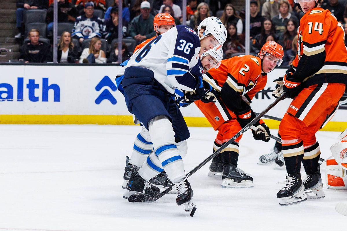 Winnipeg Jets center Morgan Barron (36) kicks the puck during an NHL match against the Anaheim Ducks on February 27, 2026 in Anaheim, California.