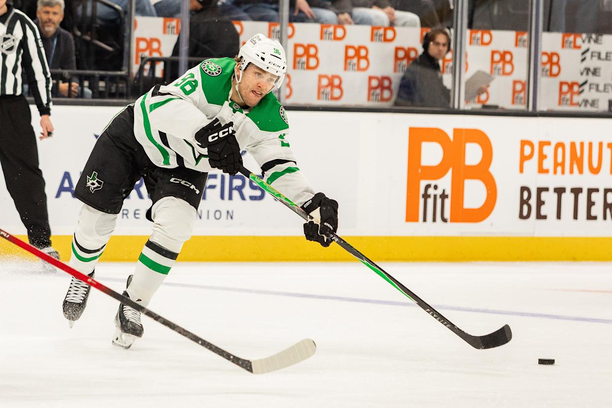 Dallas Stars right wing Mikko Rantanen (96) passes the puck against the Utah Mammoth during the second period of an NHL hockey game Saturday, Jan. 31, 2026, in Salt Lake City. (AP Photo/Melissa Majchrzak)