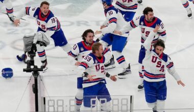 Jack Hughes (far right), celebrates with his US teammates after scoring the game winning goal.