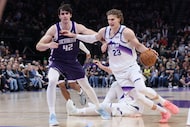 Utah Jazz forward Lauri Markkanen (23) drives to the basket against Sacramento Kings center...