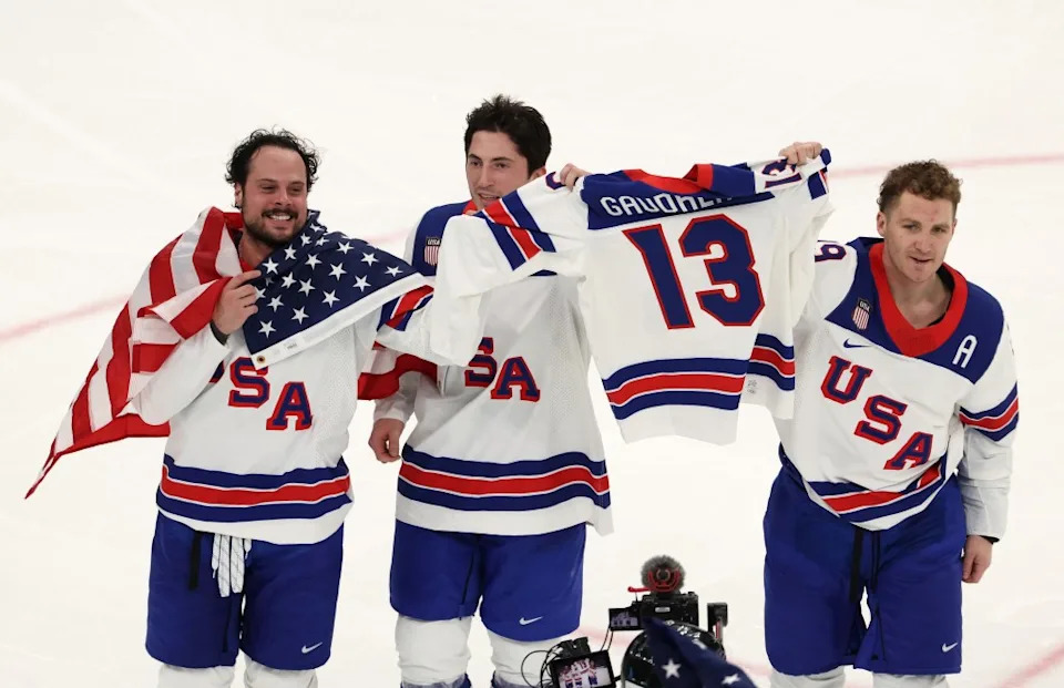 Auston Matthews, Zach Werenski and Matthew Tkachuk of Team United States celebrate winning gold with Johnny Gaudreau’s jersey after the team’s 2-1 overtime victory in during the men’s match against Canada. Getty Images