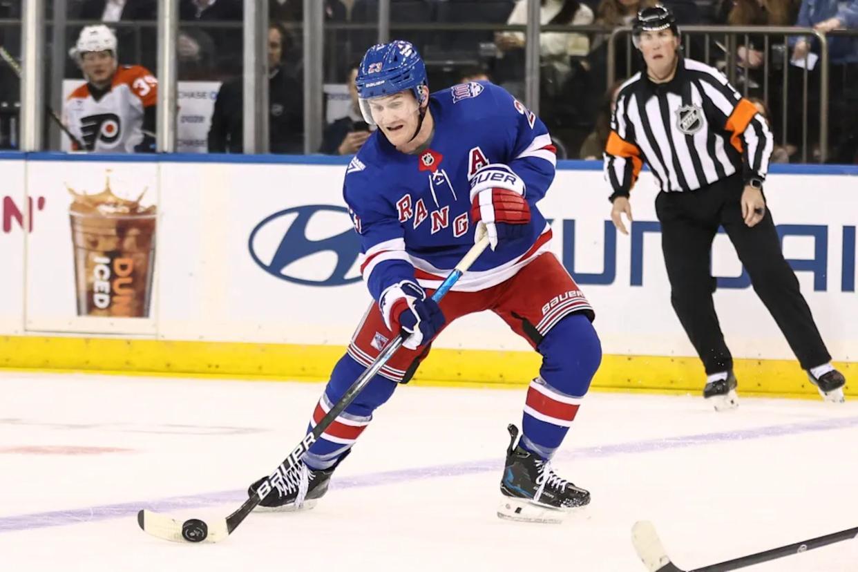 An image collage containing 1 images, Image 1 shows Adam Fox looks to make a pass during the Rangers' 3-2 overtime loss to the Flyers at the Garden on Feb. 26, 2026