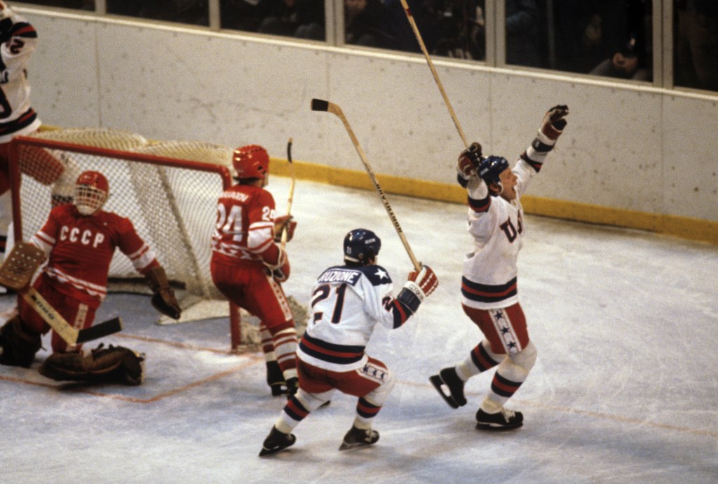 Mike Eruzione (21) celebrating a goal with Bill Baker (6) against the Soviet Union in the 1980 Winter Olympics.