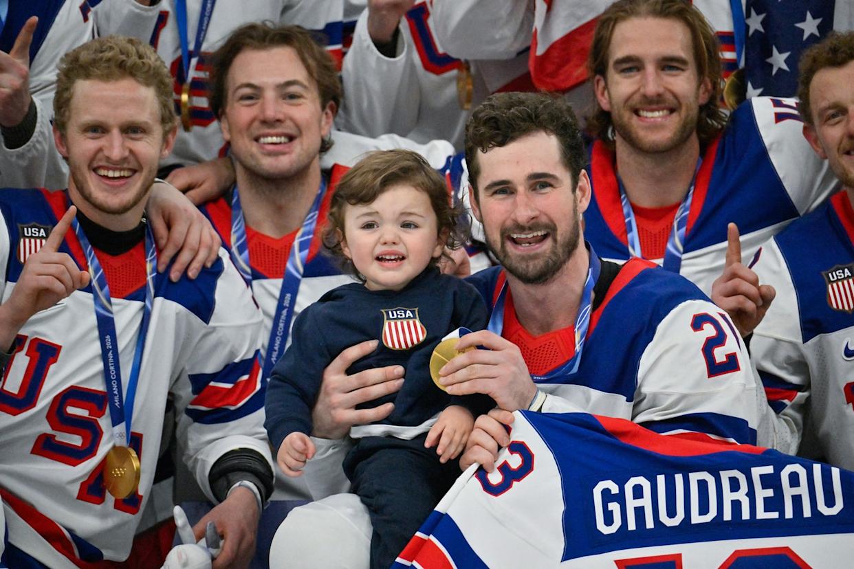 Alexander Nemenov/AFP via Getty Images - PHOTO: USA's Dylan Larkin holds Johnny Gaudreau Jr. as he celebrates with teammates after they defeated Canada to win the men's ice hockey gold medal at the Milano Cortina 2026 Winter Olympic Games in Milan, February 22, 2026.