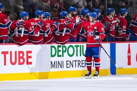 Jan 8, 2026; Montreal, Quebec, CAN; Montreal Canadiens left wing Alexandre Texier (85) celebrates with his teammates at the bench his goal against the Florida Panthers during the second period at Bell Centre.