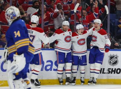 Jan 31, 2026; Buffalo, New York, USA; Montréal Canadiens right wing Cole Caufield (13) celebrates his second goal of the game with teammates during the third period against the Buffalo Sabres at KeyBank Center.