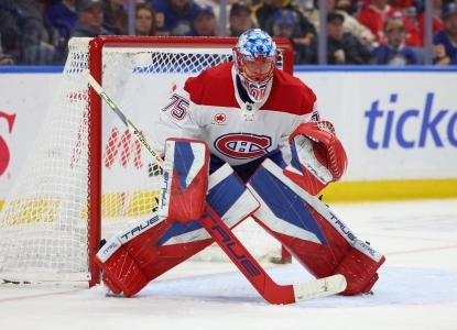 Jan 31, 2026; Buffalo, New York, USA; Montréal Canadiens goaltender Jakub Dobes (75) looks for the puck during the second period against the Buffalo Sabres at KeyBank Center.