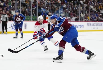 Jan 4, 2025; Denver, Colorado, USA; Colorado Avalanche center Nathan MacKinnon (29) shoots the puck in the second period against the Montreal Canadiens at Ball Arena. Mandatory Credit: Ron Chenoy-Imagn Images