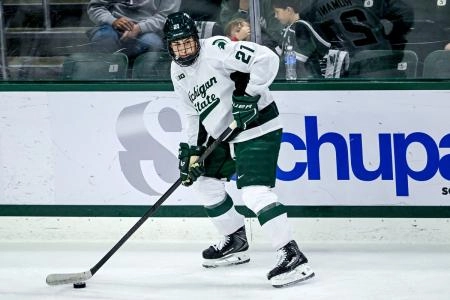 Michigan State's Anthony Romani moves the puck against New Hampshire during the second period on Thursday, Oct. 9, 2025, at Munn Ice Arena in East Lansing.