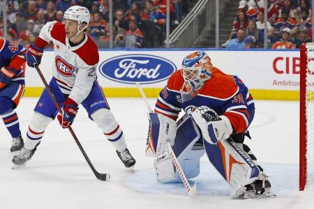 Oct 23, 2025; Edmonton, Alberta, CAN; Montreal Canadiens forward Juraj Slafkovsky (20) looks for a pass in front of Edmonton Oilers goaltender Calvin Pickard (30) during the second period at Rogers Place. Mandatory Credit: Perry Nelson-Imagn Images