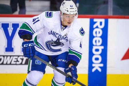 Sep 25, 2015; Calgary, Alberta, CAN; Vancouver Canucks left wing Ronalds Kenins (41) skates during the warmup period against the Calgary Flames at Scotiabank Saddledome.