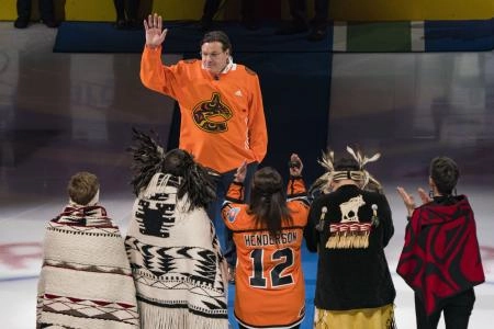 Mar 30, 2022; Vancouver, British Columbia, CAN; Vancouver Canucks chairman and governor Francesco Aquilini waves to the crowd as part of the pregame ceremonies with other indigenous leaders prior to the game between the Canucks and the St. Louis Blues at Rogers Arena.