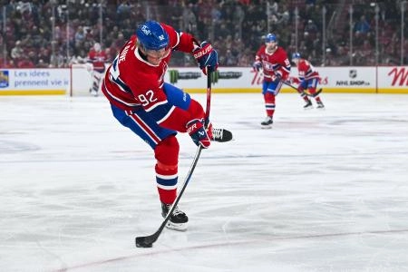 Mar 22, 2025; Montreal, Quebec, CAN; Montreal Canadiens right wing Patrik Laine (92) shoots the puck against the Colorado Avalanche in the first period at Bell Centre. Mandatory Credit: David Kirouac-Imagn Images