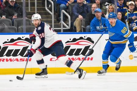 Jan 31, 2026; St. Louis, Missouri, USA; Columbus Blue Jackets center Boone Jenner (38) controls the puck against the St. Louis Blues during the first period at Enterprise Center. Mandatory Credit: Jeff Curry-Imagn Images