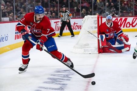 Jan 12, 2026; Montreal, Quebec, CAN; Montreal Canadiens defenseman Arber Xhekaj (72) defends the puck against the Vancouver Canucks during the third period at Bell Centre. Mandatory Credit: David Kirouac-Imagn Images