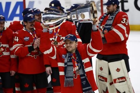 Feb 20, 2025; Boston, MA, USA; [Imagn Images direct customers only] Team Canada forward Sam Reinhart (13) lifts the trophy after defeating the United States during the 4 Nations Face-Off ice hockey championship game at TD Garden.