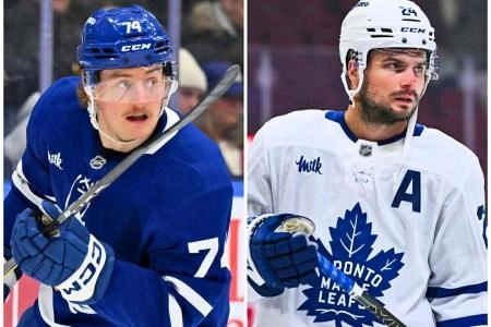 Toronto Maple Leafs forwards Bobby McMann (left) and Scott Laughton (right)