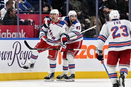 Mar 2, 2024; Toronto, Ontario, CAN; New York Rangers forward Vincent Trochek (16) celebrates with forward Mika Zibanejadl (93) after scoring against the Toronto Maple Leafs in the third period at Scotiabank Arena.