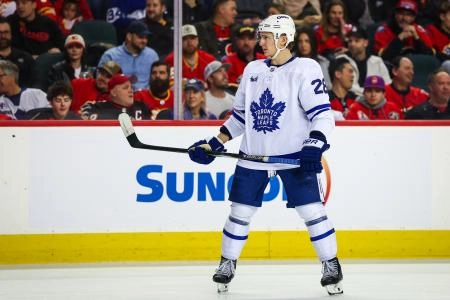 Feb 2, 2026; Calgary, Alberta, CAN; Toronto Maple Leafs defenseman Troy Stecher (28) against the Calgary Flames during the third period at Scotiabank Saddledome.