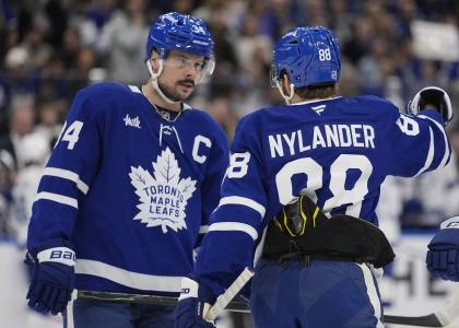 Dec 8, 2025; Toronto, Ontario, CAN; Toronto Maple Leafs forward William Nylander (88) and forward Auston Matthews (34) discuss a play against the Tampa Bay Lightning during the first period at Scotiabank Arena. Mandatory Credit: John E. Sokolowski-Imagn Images