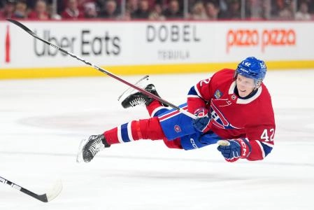 Dec 16, 2025; Montreal, Quebec, CAN; Montreal Canadians defenseman Adam Engstrom (42) takes a shot on net during the first period of the game against the Philadelphia Flyers at the Bell Centre.
