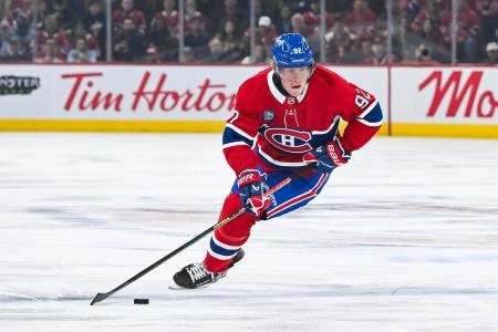 Mar 22, 2025; Montreal, Quebec, CAN; Montreal Canadiens right wing Patrik Laine (92) plays the puck against the Colorado Avalanche in the first period at Bell Centre.