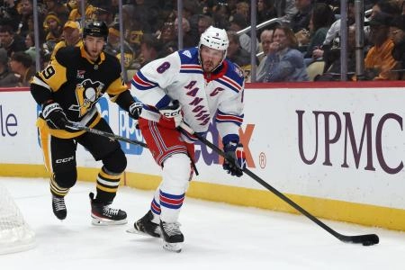Jan 31, 2026; Pittsburgh, Pennsylvania, USA; New York Rangers center J.T. Miller (8) moves the puck against Pittsburgh Penguins right wing Egor Chinakhov (59) during the second period at PPG Paints Arena.
