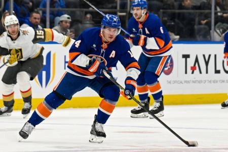 Dec 9, 2025; Elmont, New York, USA; New York Islanders center Bo Horvat (14) skates across center ice against the Vegas Golden Knights during the second period at UBS Arena.