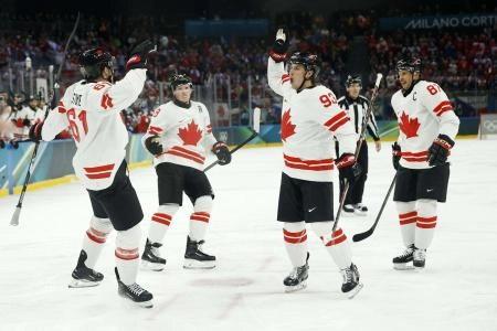 Feb 12, 2026; Milan, Italy; Mark Stone of Canada celebrates scoring their second goal with Mitch Marner of Canada against Czechia in a men's ice hockey group A match during the Milano Cortina 2026 Olympic Winter Games at Milano Santagiulia Ice Hockey Arena. Mandatory Credit: Geoff Burke-Imagn Images