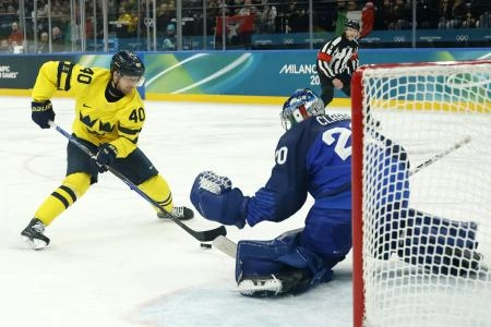 Feb 11, 2026; Milan, Italy; Elias Pettersson of Sweden shoots at goal as Damian Clara of Italy makes a save in men's ice hockey group B play during the Milano Cortina 2026 Olympic Winter Games at Milano Santagiulia Ice Hockey Arena.