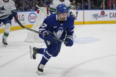Nov 12, 2022; Toronto, Ontario, CAN; Toronto Maple Leafs forward Denis Malgin (62) skates against the Vancouver Canucks during the first period at Scotiabank Arena. Mandatory Credit: John E. Sokolowski-Imagn Images