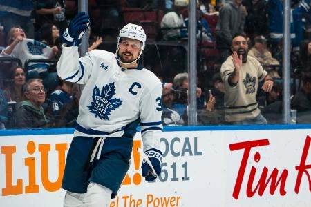 Jan 31, 2026; Vancouver, British Columbia, CAN; Toronto Maple Leafs forward Auston Matthews (34) celebrates his game winning shootout goal against the Vancouver Canucks at Rogers Arena. Mandatory Credit: Bob Frid-Imagn Images