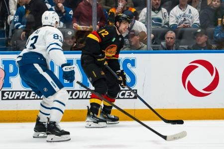 Jan 31, 2026; Vancouver, British Columbia, CAN; Vancouver Canucks forward Filip Chytil (72) handles the puck against the Toronto Maple Leafs in the second period at Rogers Arena.