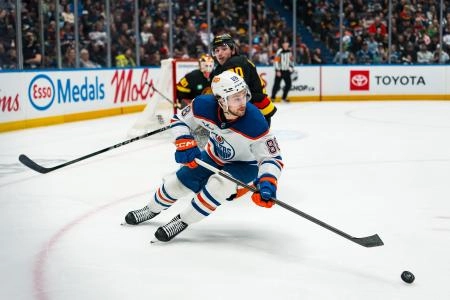 Jan 17, 2026; Vancouver, British Columbia, CAN; Edmonton Oilers forward Andrew Mangiapane (88) handles the puck against the Vancouver Canucks in the third period at Rogers Arena.
