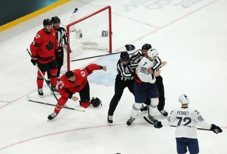 [US, Mexico  Canada customers only] Feb 15, 2026; Milan, Italy; Tom Wilson of Canada clashes with Pierre Crinon of France in men's ice hockey group A play during the Milano Cortina 2026 Olympic Winter Games at Milano Santagiulia Ice Hockey Arena.
