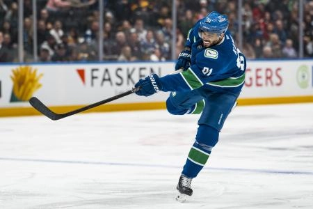 Jan 25, 2026; Vancouver, British Columbia, CAN; Vancouver Canucks forward Evander Kane (91) shoots against the Pittsburgh Penguins in the second period at Rogers Arena.