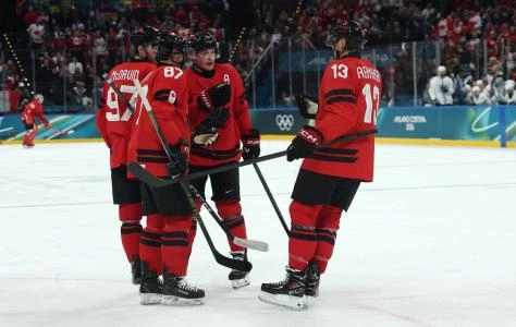 Feb 15, 2026; Milan, Italy; Cale Makar of Canada, Sidney Crosby of Canada, Connor McDavid of Canada and Sam Reinhart of Canada react against France in men's ice hockey group A play during the Milano Cortina 2026 Olympic Winter Games at Milano Santagiulia Ice Hockey Arena. Mandatory Credit: Geoff Burke-Imagn Images