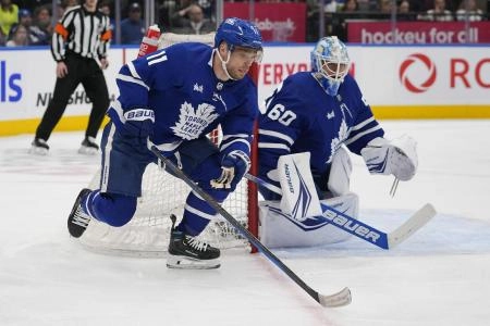 Feb 29, 2024; Toronto, Ontario, CAN; Toronto Maple Leafs forward Max Domi (11) skates past goaltender Joseph Woll (60) during the second period against the Arizona Coyotes at Scotiabank Arena.