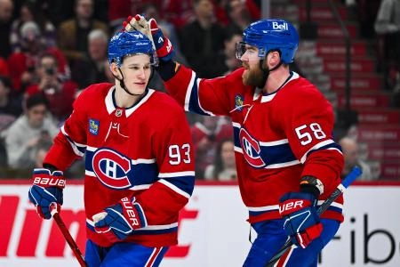 Apr 14, 2025; Montreal, Quebec, CAN; Montreal Canadiens defenseman David Savard (58) congratulates right wing Ivan Demidov (93) after his first career NHL goal against the Chicago Blackhawks in the first period at Bell Centre.