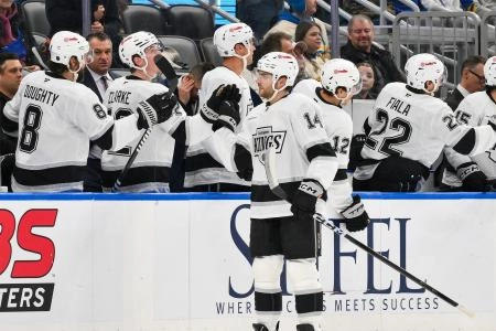 Jan 24, 2026; St. Louis, Missouri, USA; Los Angeles Kings right wing Alex Laferriere (14) is congratulated by teammates after scoring against the St. Louis Blues during the second period at Enterprise Center.
