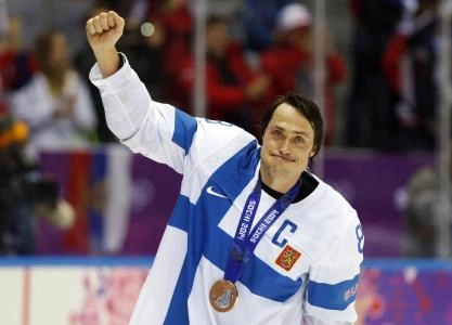 Feb 22, 2014; Sochi, RUSSIA; Finland forward Teemu Selanne (8) waves to the crowd after receiving his bronze medal for defeating USA in the men's ice hockey bronze medal game during the Sochi 2014 Olympic Winter Games at Bolshoy Ice Dome.