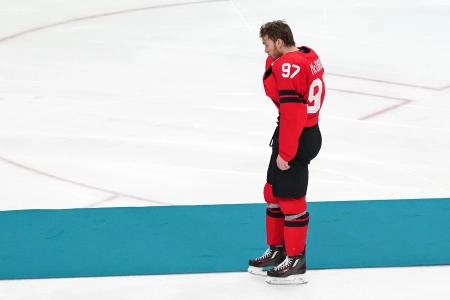 Feb 22, 2026; Milan, Italy; Connor McDavid of Canada reacts after losing to the United States in the men's ice hockey gold medal game during the Milano Cortina 2026 Olympic Winter Games at Milano Santagiulia Ice Hockey Arena. Mandatory Credit: James Lang-Imagn Images