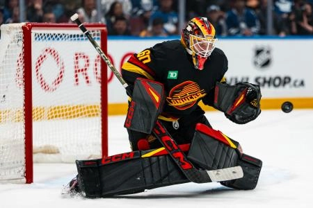 Jan 31, 2026; Vancouver, British Columbia, CAN; Vancouver Canucks goalie Nikita Tolopilo (60) makes a save against the Toronto Maple Leafs in the third period at Rogers Arena.