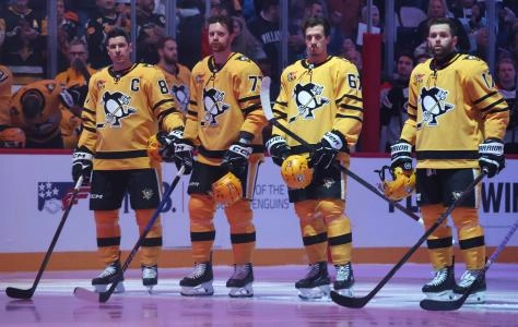 Jan 15, 2026; Pittsburgh, Pennsylvania, USA; The Pittsburgh Penguins starting line up including center Sidney Crosby (87) and defenseman Brett Kulak (77) and left wing Rickard Rakell (67) and right wing Bryan Rust (17) stand for the national anthem against the Philadelphia Flyers at PPG Paints Arena.