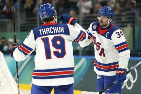 Feb 22, 2026; Milan, Italy; Auston Matthews #34 of Team United States celebrates after the game against Team Canada during the Milano Cortina 2026 Olympic Winter Games at Milano Santagiulia Ice Hockey Arena