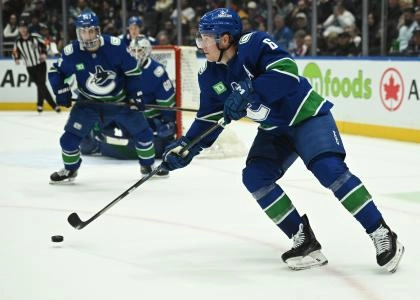 Feb 25, 2026; Vancouver, British Columbia, CAN; Vancouver Canucks right wing Brock Boeser (6) skates with the puck against against the Winnipeg Jets during the second period at Rogers Arena.