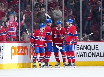 Jan 29, 2026; Montreal, Quebec, CAN; Montreal Canadiens forward Kirby Dach (77) celebrates with teammates after scoring a goal against the Colorado Avalanche during the second period at the Bell Centre.