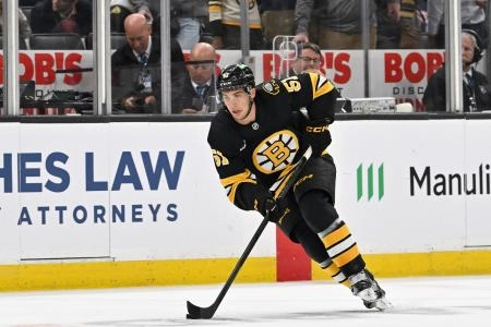 Sep 29, 2025; Boston, Massachusetts, USA; Boston Bruins center Matthew Poitras (51) carries the puck through the neutral zone during the first period against the Philadelphia Flyers at TD Garden.