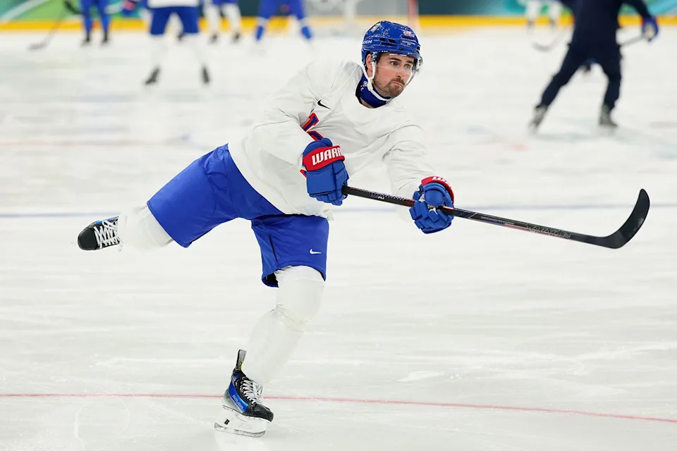 Dylan Larkin skating and handling a hockey stick on the ice rink during practice Gregory Shamus/Getty